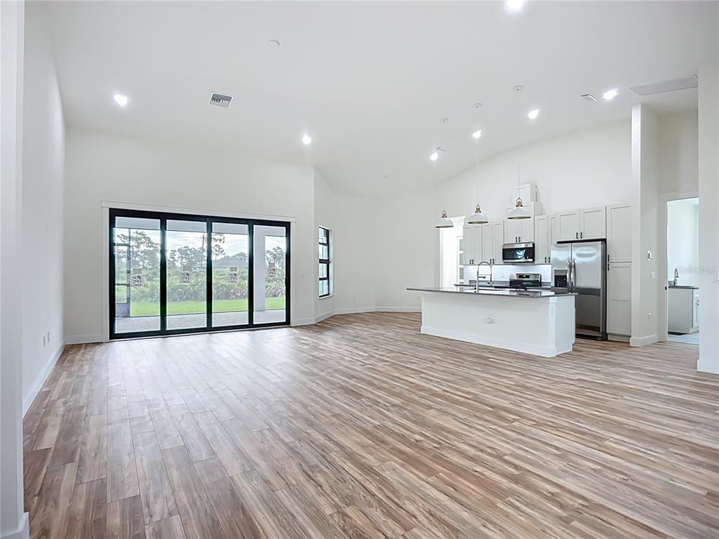 15 Heave Lane Placida, FL 33946 - Photo 11 of 70 a view of kitchen with wooden floor and window