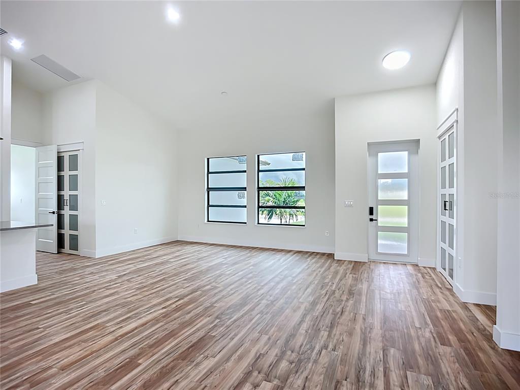 15 Heave Lane Placida, FL 33946 - Photo 14 of 70 wooden floor in an empty room with a window