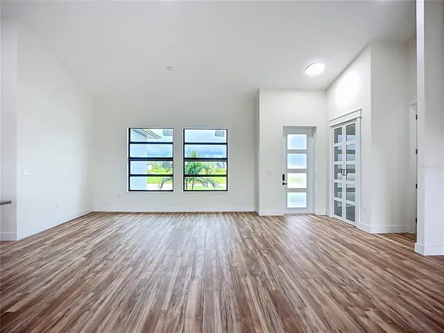a view of kitchen with wooden floor and electronic appliances