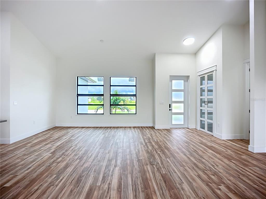 15 Heave Lane Placida, FL 33946 - Photo 15 of 70 wooden floor in an empty room with a window