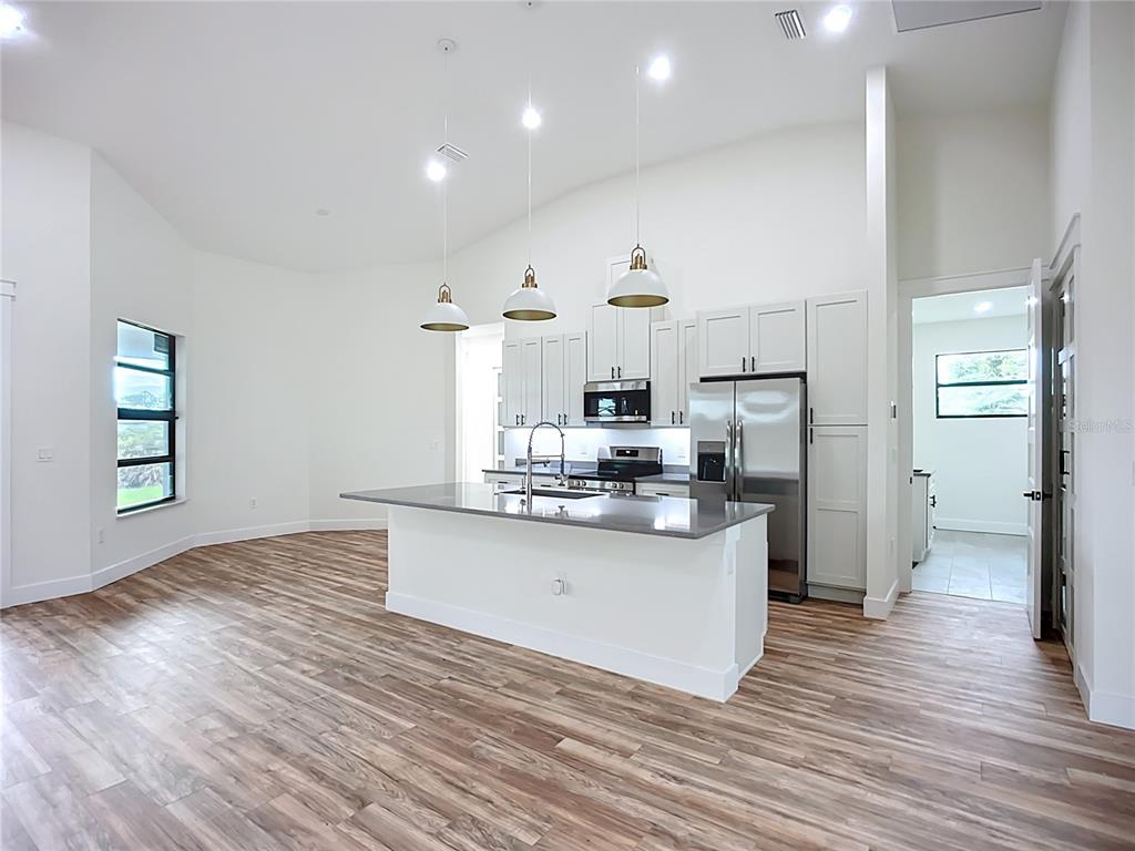 15 Heave Lane Placida, FL 33946 - Photo 17 of 70 a kitchen with stainless steel appliances a refrigerator and a stove top oven
