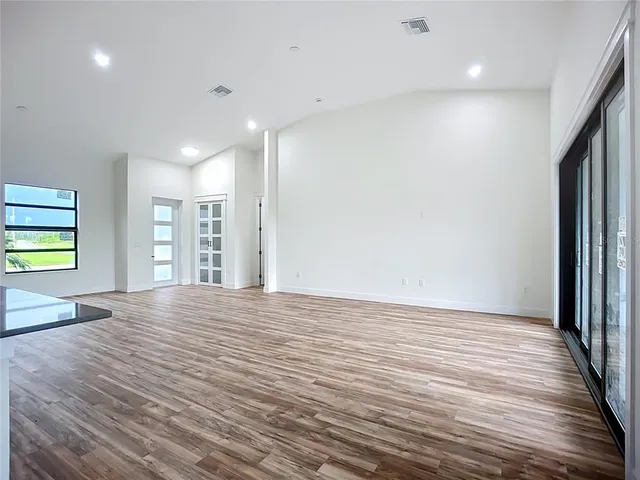 a kitchen with stainless steel appliances granite countertop a stove oven and a sink with granite countertops