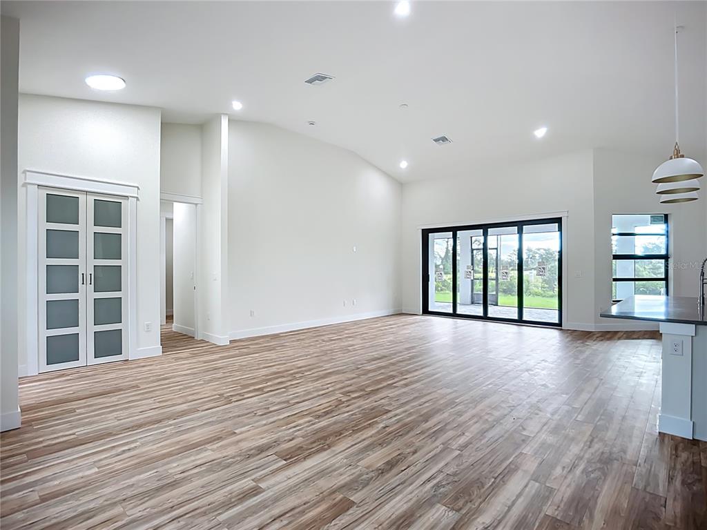 15 Heave Lane Placida, FL 33946 - Photo 29 of 70 an empty room with wooden floor and windows