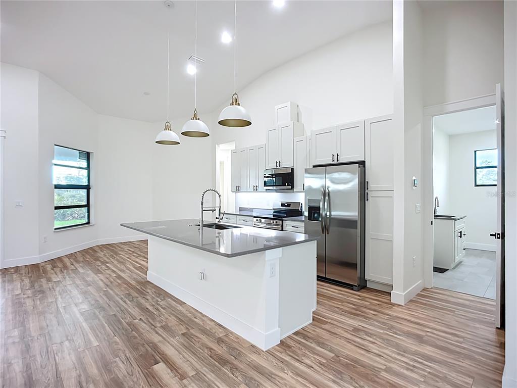 15 Heave Lane Placida, FL 33946 - Photo 30 of 70 a kitchen with stainless steel appliances granite countertop a sink and a refrigerator