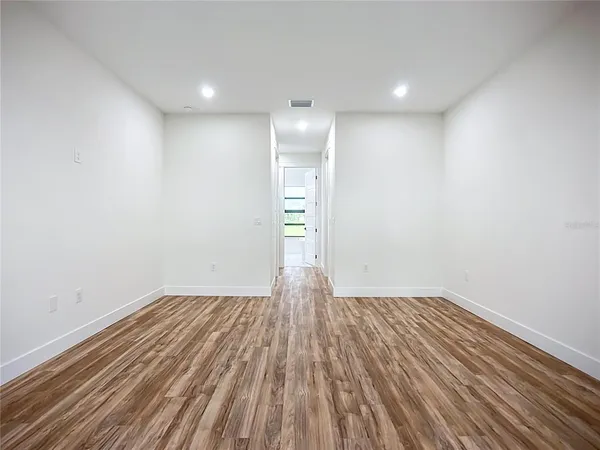 a spacious bathroom with double sink and a mirror