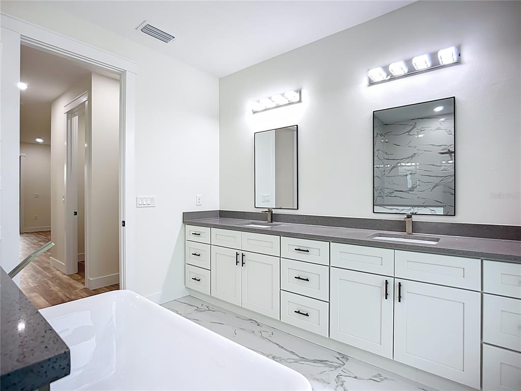 15 Heave Lane Placida, FL 33946 - Photo 43 of 70 a spacious bathroom with double sink and a mirror