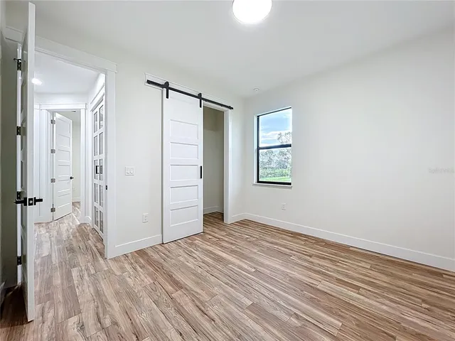 a aerial view of a house next to a big yard