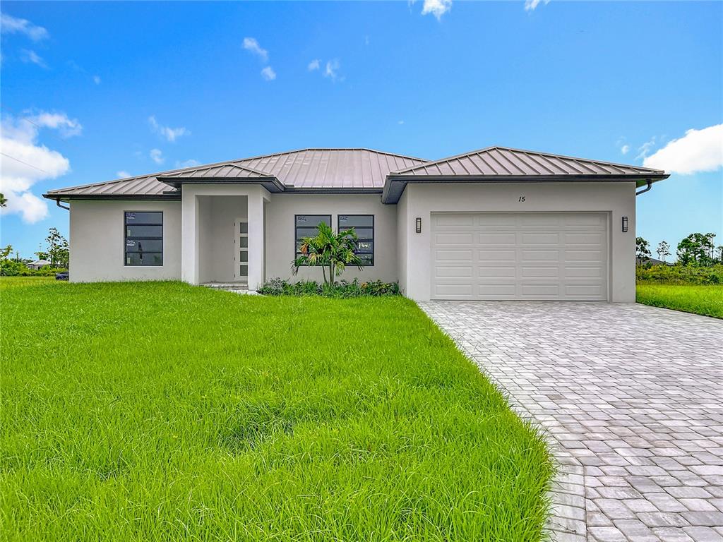 15 Heave Lane Placida, FL 33946 - Photo 7 of 70 a front view of a house with a yard and garage