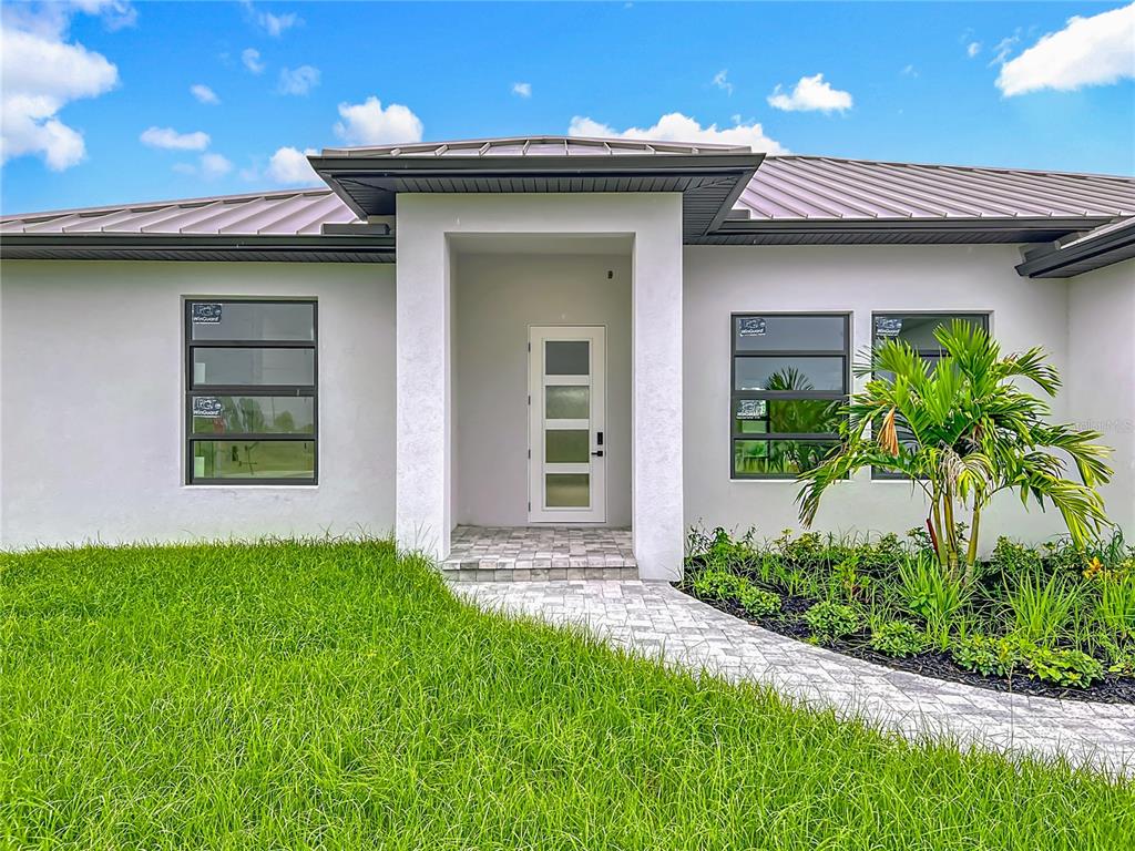 15 Heave Lane Placida, FL 33946 - Photo 9 of 70 a view of a house with potted plants and a yard
