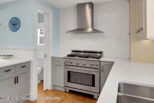 a kitchen with cabinets and a stove
