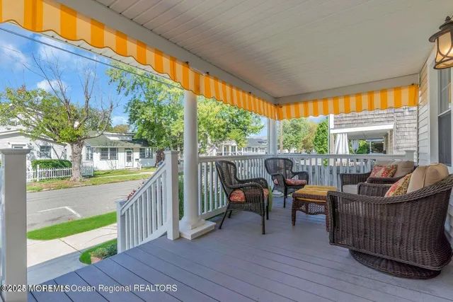 a view of a two chairs in the balcony