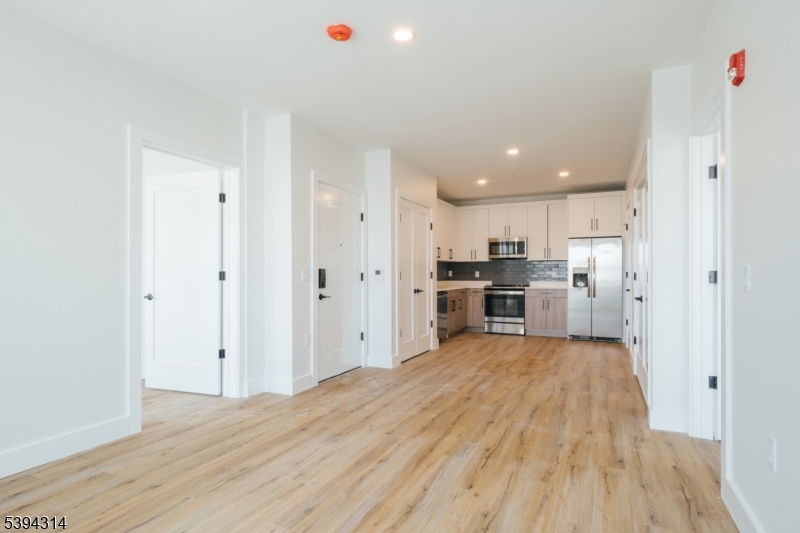 67 Summer Avenue, Unit 101 Newark, NJ 07104 - Photo 4 of 26 a view of kitchen with wooden floor