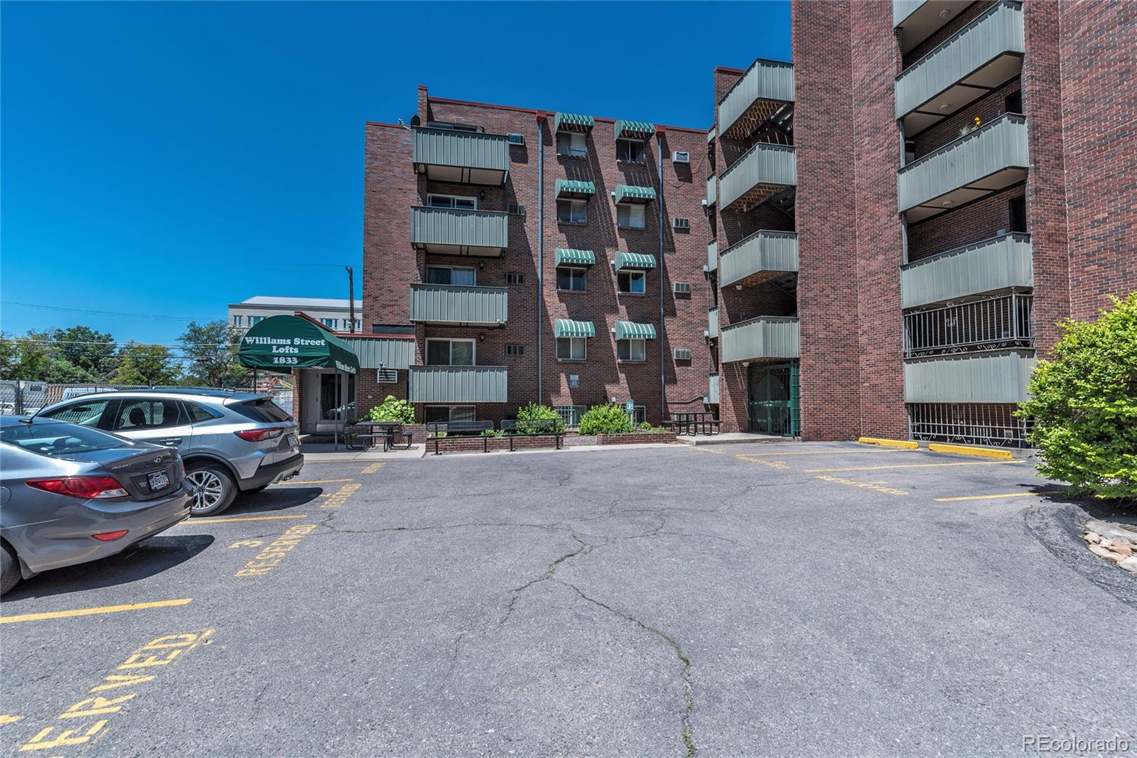 1833 North Williams Street, Unit 504 Denver, CO 80218 - Photo 15 of 19 a view of building with cars parked in front of it
