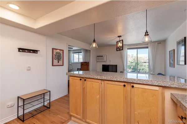 a large white kitchen with a large window