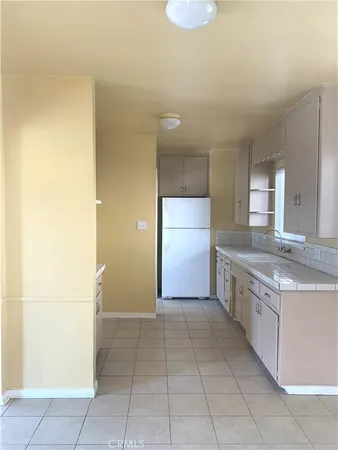 a large bathroom with a sink and a large mirror