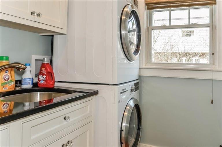 6 Yacht Club Road Falmouth, MA 02536 - Photo 14 of 35 a view of washer and dryer with kitchen in the background