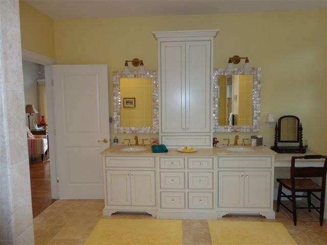 6 Yacht Club Road Falmouth, MA 02536 - Photo 20 of 35 a bathroom with a double vanity sink a mirror and a bathtub