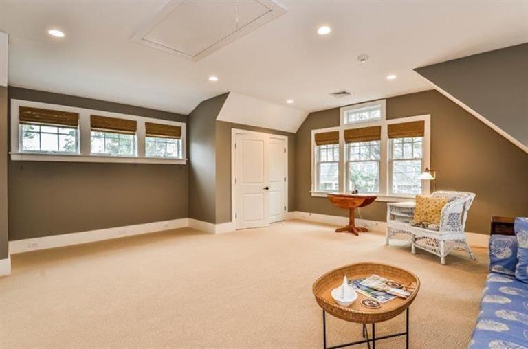 6 Yacht Club Road Falmouth, MA 02536 - Photo 25 of 35 a living room with furniture a fireplace and a large window