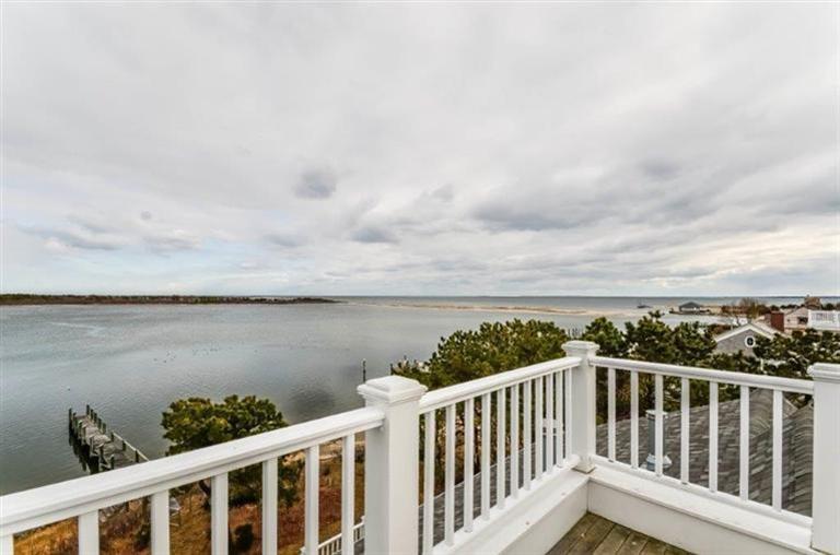 6 Yacht Club Road Falmouth, MA 02536 - Photo 29 of 35 a balcony with wooden floor space and lake view