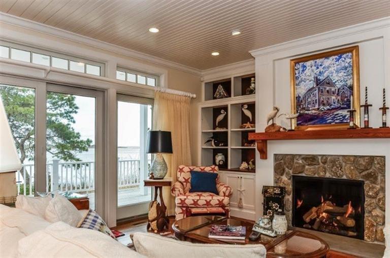 6 Yacht Club Road Falmouth, MA 02536 - Photo 4 of 35 a living room with furniture a fireplace and a large window