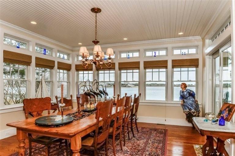 6 Yacht Club Road Falmouth, MA 02536 - Photo 6 of 35 a view of a dining room with furniture large windows and wooden floor