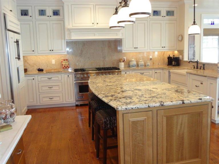 6 Yacht Club Road Falmouth, MA 02536 - Photo 8 of 35 a kitchen with granite countertop wooden cabinets and white appliances