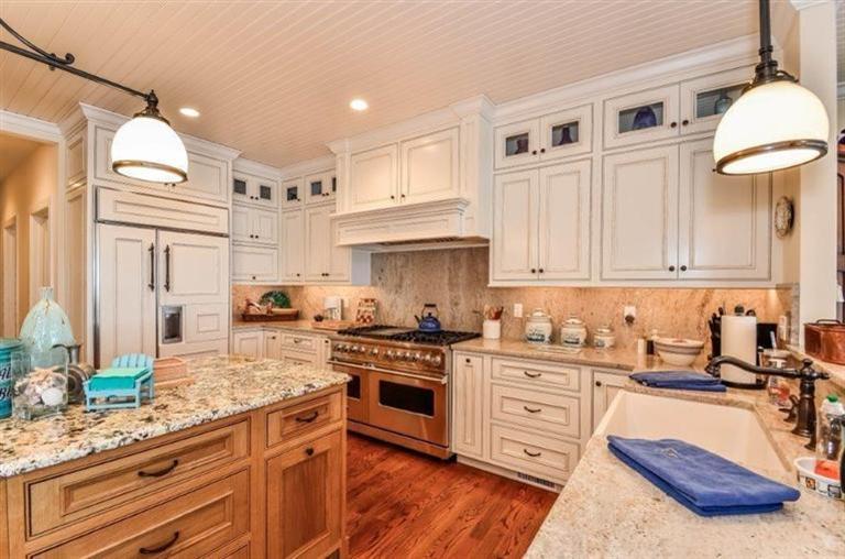 6 Yacht Club Road Falmouth, MA 02536 - Photo 9 of 35 a kitchen with granite countertop a sink a stove and cabinets
