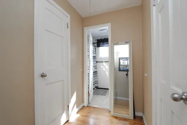 a view of a bathroom from a hallway