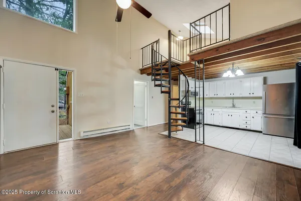 a view of entryway with wooden floor