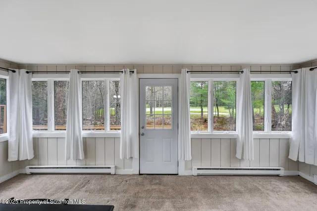 a view of a livingroom with furniture and window