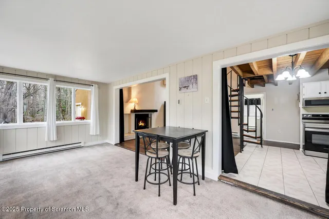 a view of a livingroom with furniture and wooden floor