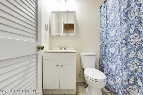a bathroom with a sink and a toilet