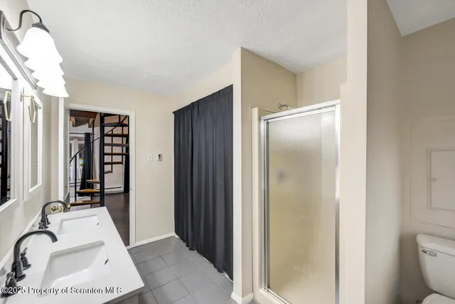 a view of an empty room with stairs