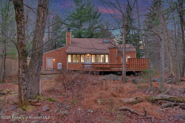 a backyard of a house with oven and outdoor seating