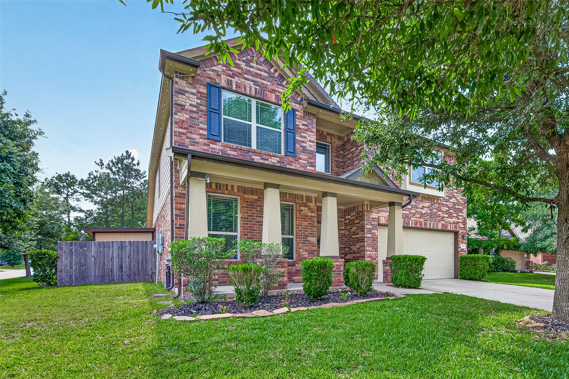 8 Landscape Court Conroe, TX 77301 - Photo 1 of 43 front view of a house with a yard