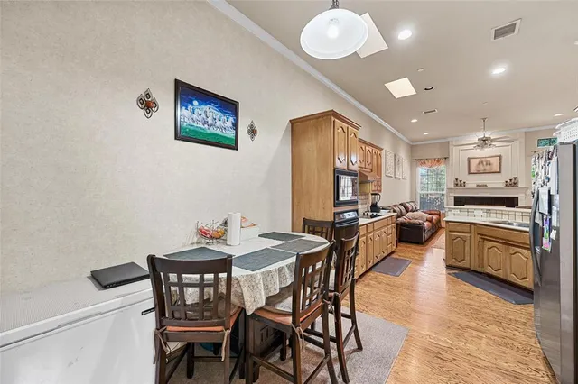 a view of a dining room with furniture and a livingroom