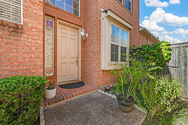 a view of a potted plants in front of a house