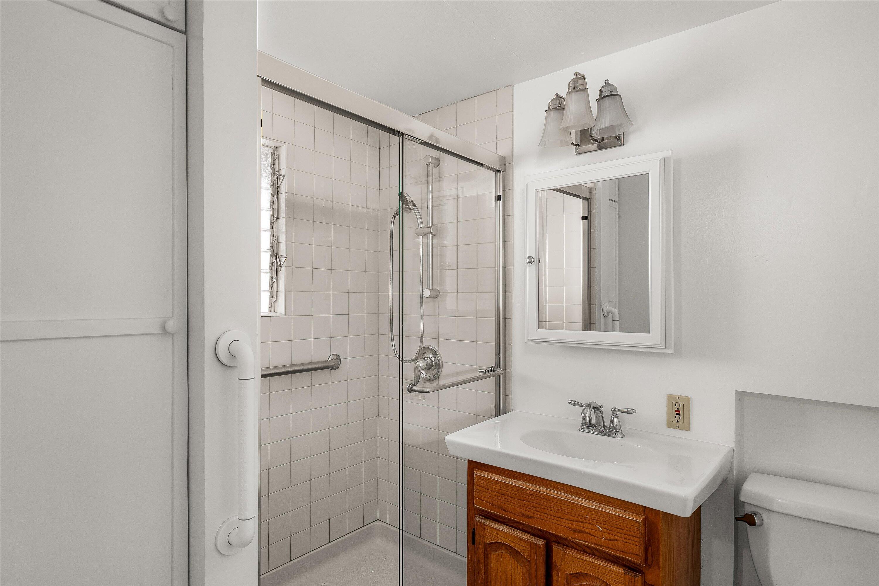 532 Brinkerhoff Avenue Santa Barbara, CA 93101 - Photo 13 of 30 a bathroom with a sink vanity toilet and shower