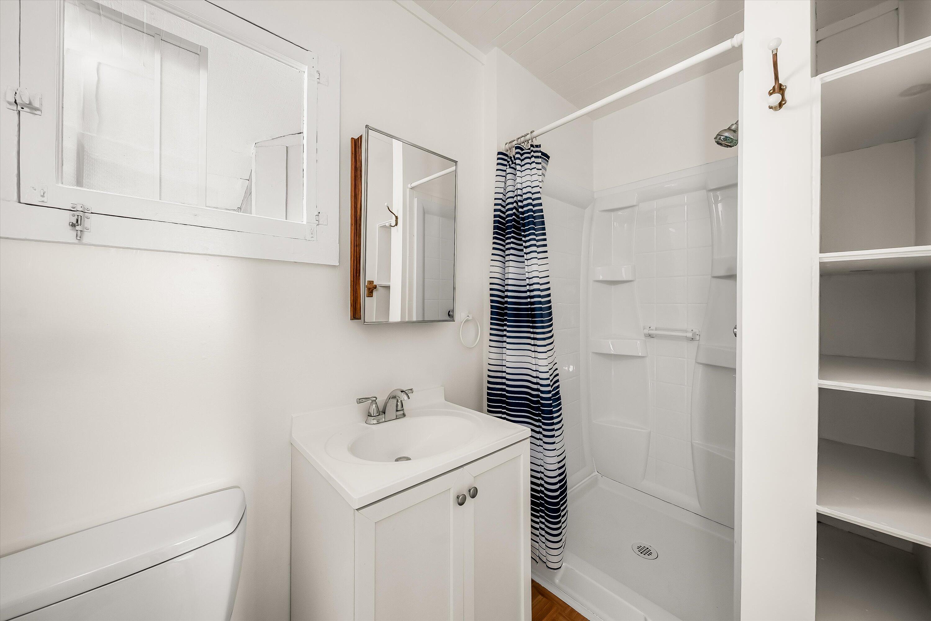 532 Brinkerhoff Avenue Santa Barbara, CA 93101 - Photo 21 of 30 a bathroom with a sink and a mirror