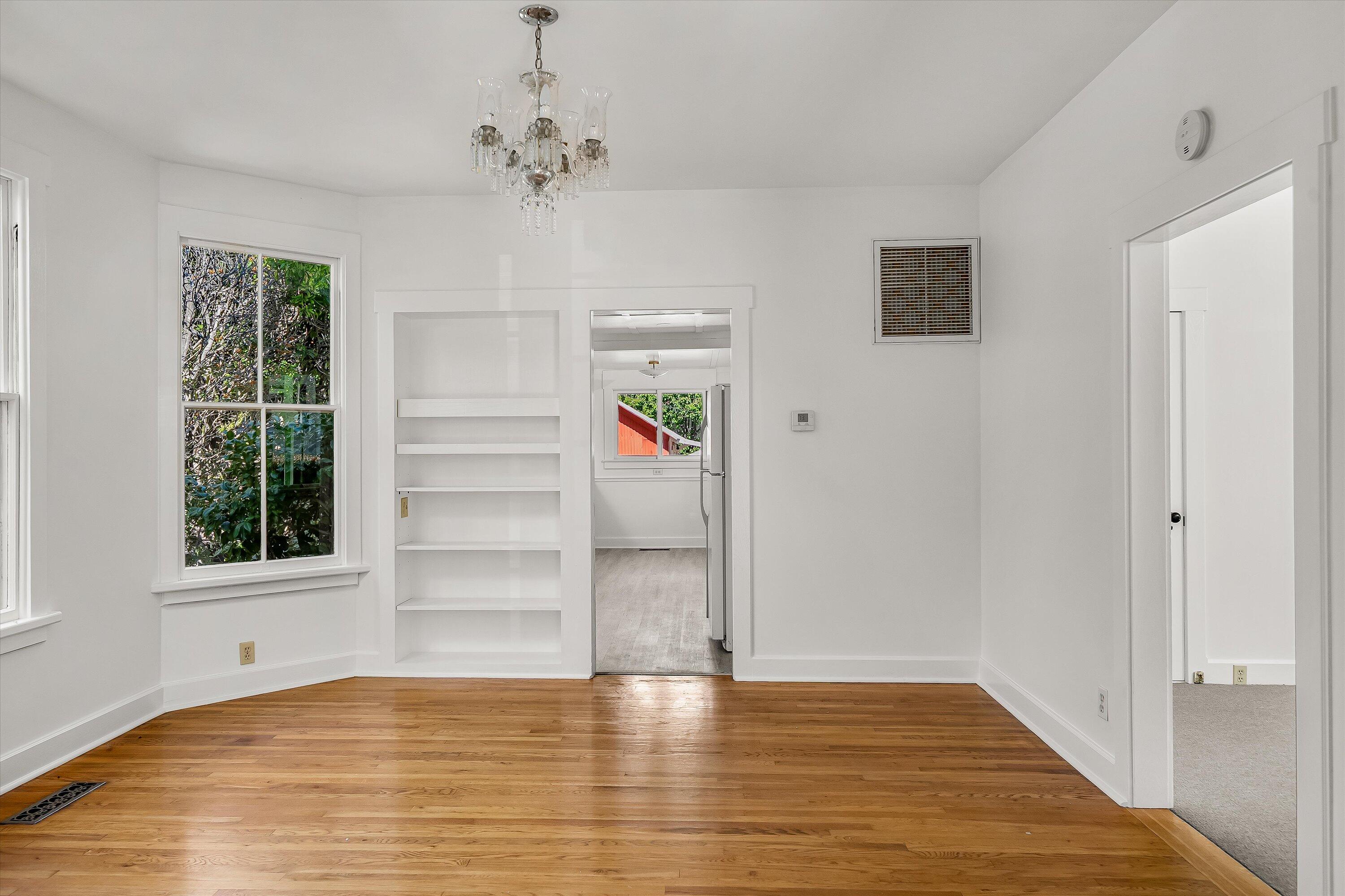 532 Brinkerhoff Avenue Santa Barbara, CA 93101 - Photo 7 of 30 a view of an empty room with a window and wooden floor