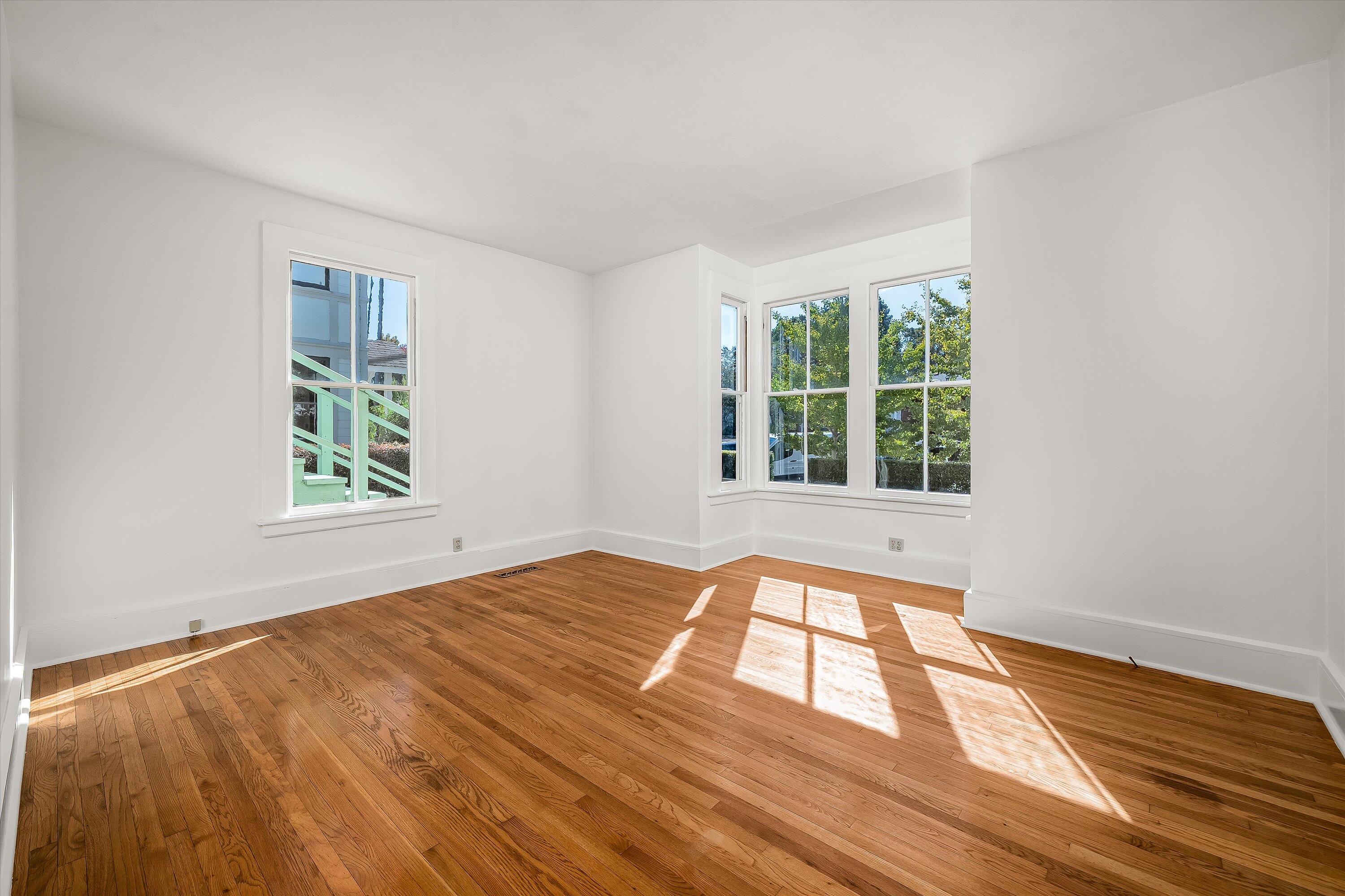 532 Brinkerhoff Avenue Santa Barbara, CA 93101 - Photo 9 of 30 a view of an empty room with wooden floor and a window