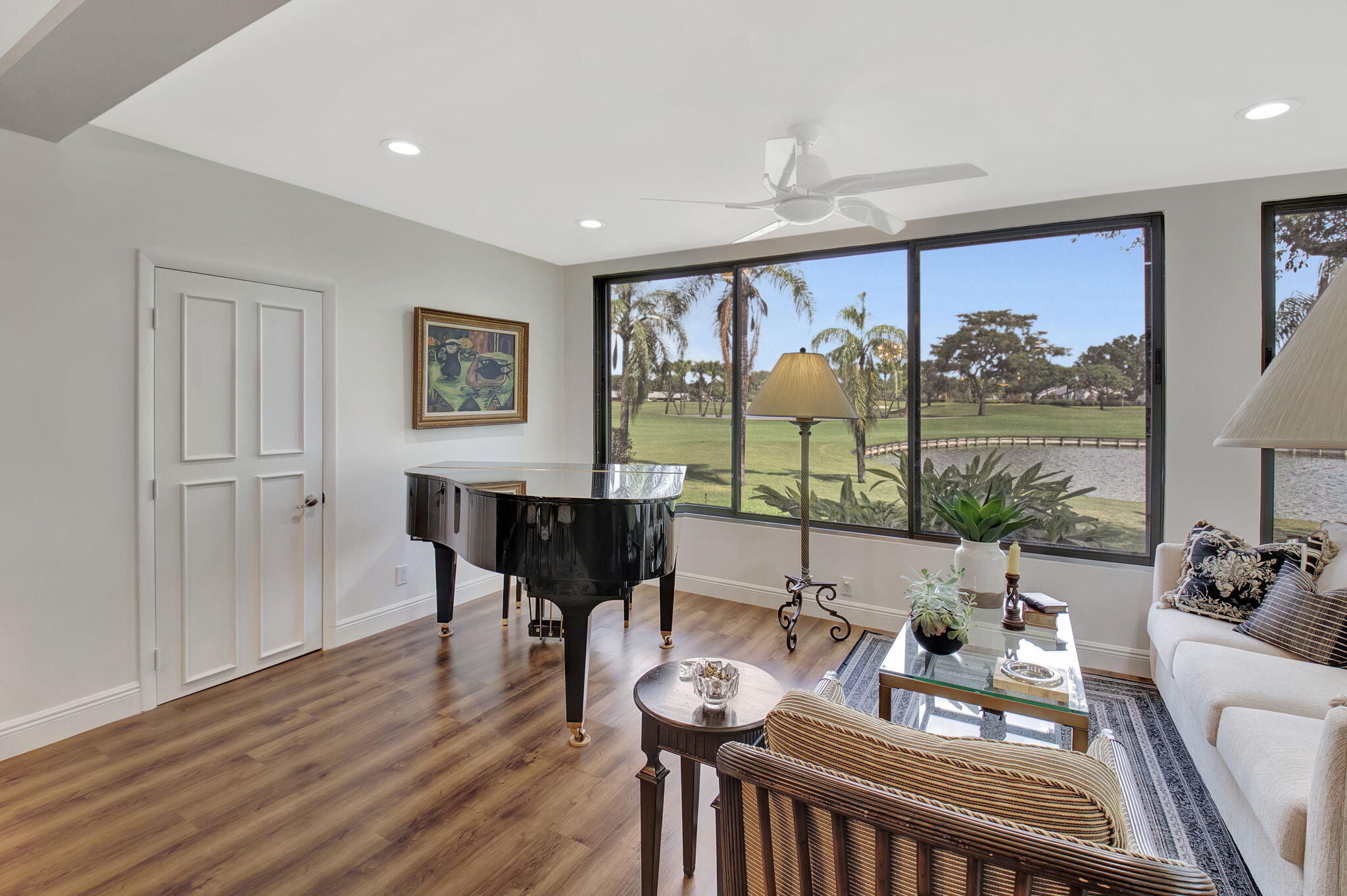 27 Eastgate Drive, Unit C Boynton Beach, FL 33436 - Photo 19 of 87 a view of a dining room with furniture large windows and wooden floor
