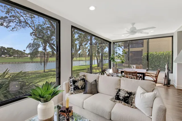 a spacious bedroom with a bed and a chandelier