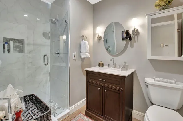 a aerial view of a house with big yard and large trees