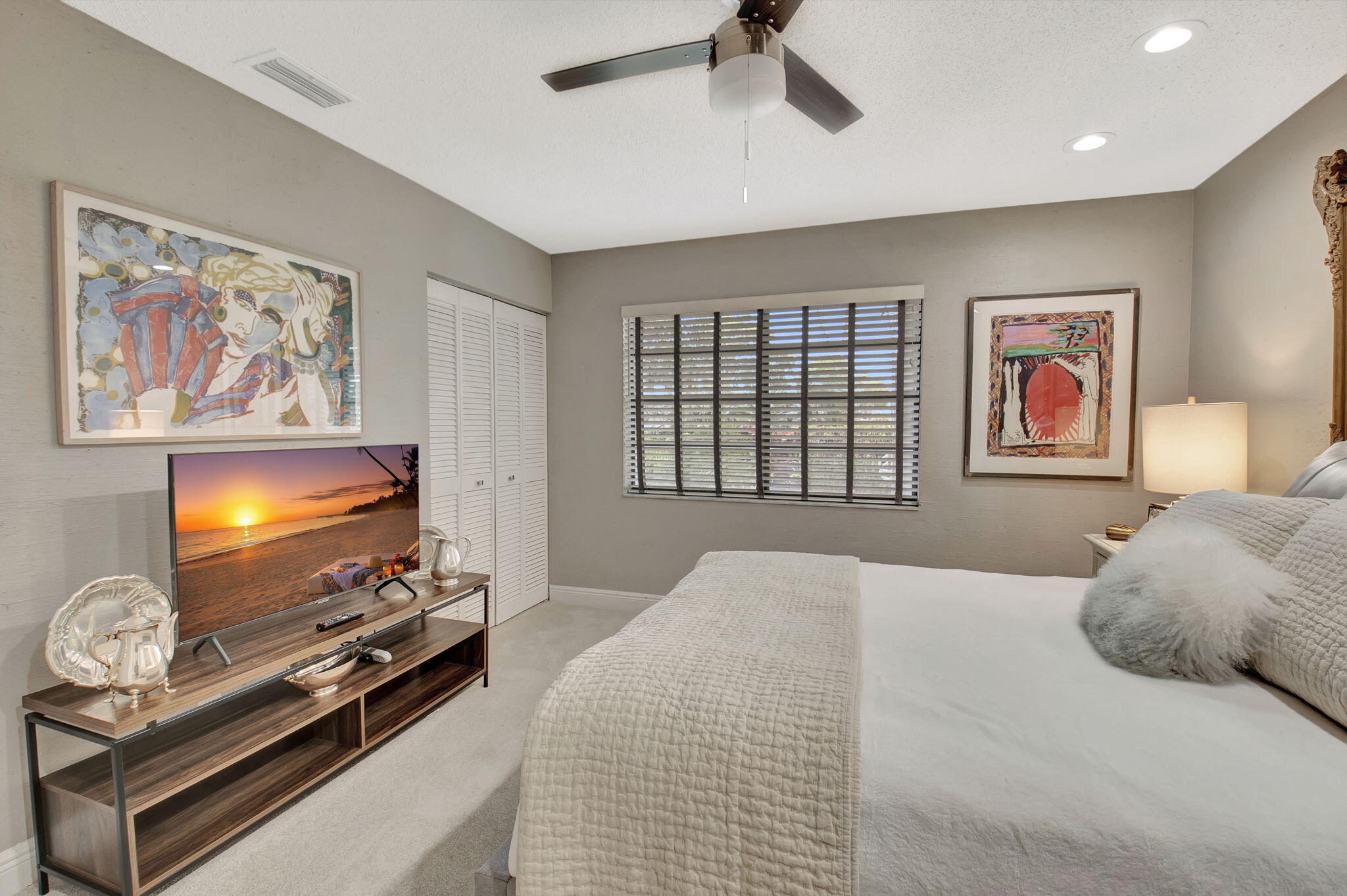 27 Eastgate Drive, Unit C Boynton Beach, FL 33436 - Photo 32 of 87 a bedroom with furniture and a flat screen tv