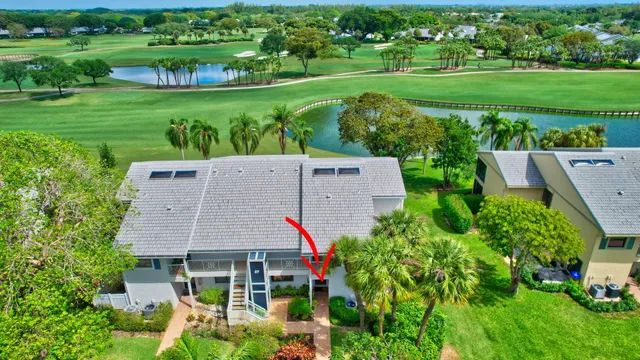 a view of a dining room with furniture and a kitchen