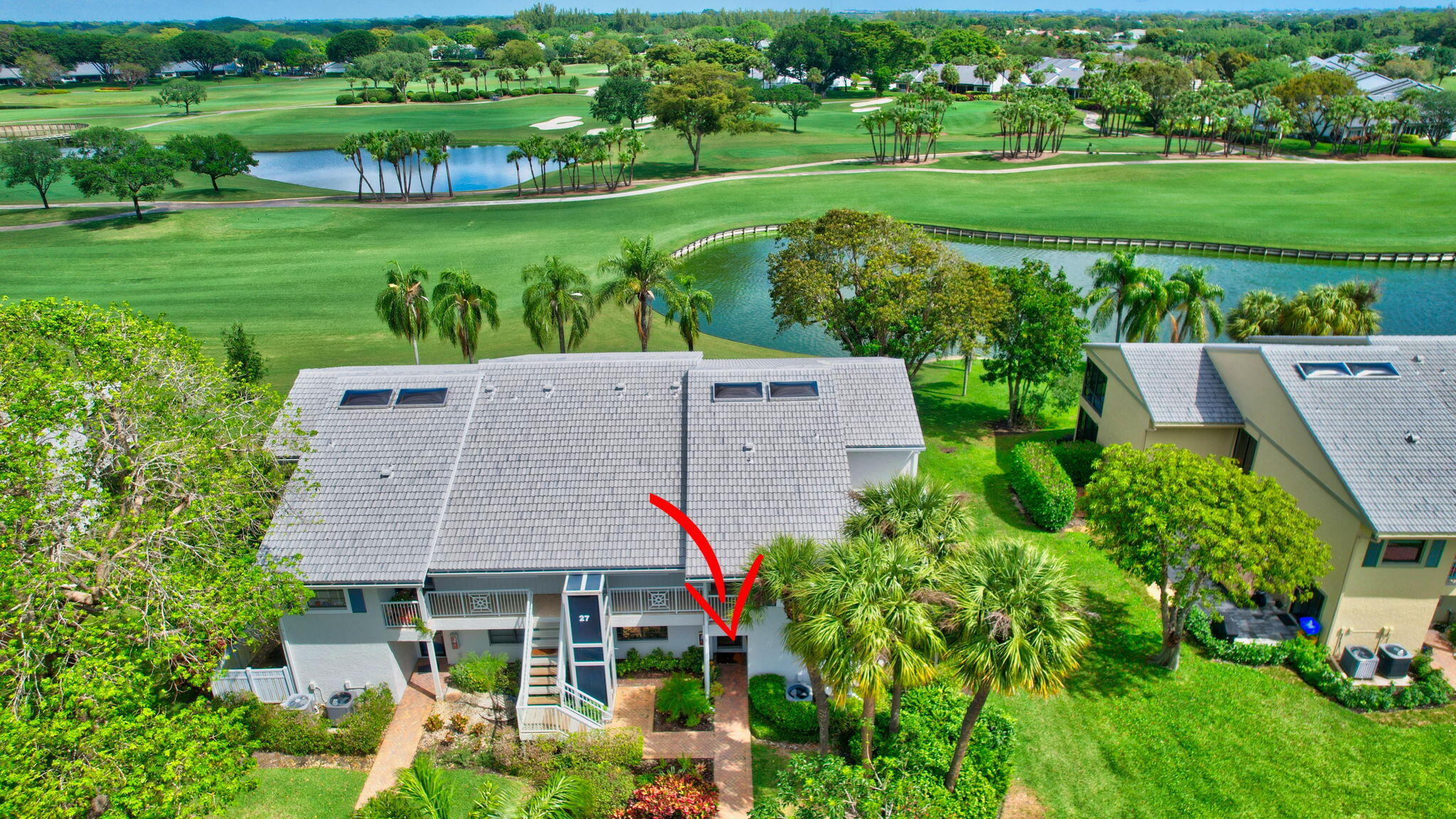 27 Eastgate Drive, Unit C Boynton Beach, FL 33436 - Photo 46 of 87 a aerial view of a house with big yard and large trees