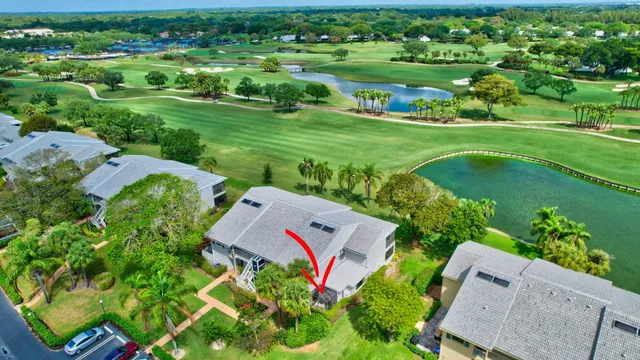 a view of swimming pool with outdoor seating and plants