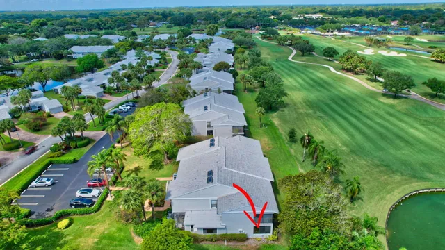 a view of a swimming pool with a yard