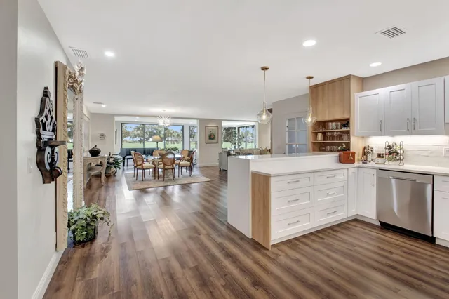 a kitchen with stainless steel appliances a stove microwave and cabinets